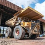 Heavy equipment repair shop bay with a haul truck